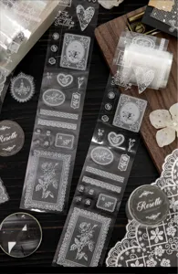 Detailed close-up of vintage white lace floral PET tape stickers for DIY scrapbooking journal