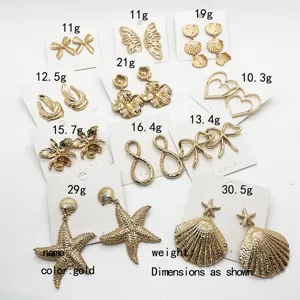 Exaggerated gold alloy earrings set featuring vintage shell, starfish and floral designs