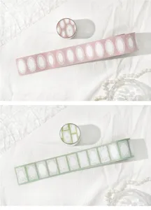 Macro view of lace border washi tape patterns in pink and green for DIY scrapbooks.