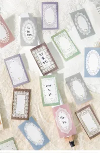 Macro view of colorful lace border stickers with vintage phrases and floral patterns