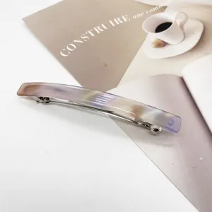 Detailed view of a rectangular resin hair clip with elegant purple marble texture.