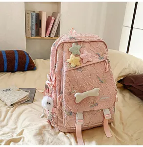 Mochila rosa acolchada con estrellas de peluche y bordado de lazos