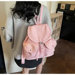 Detailed back view of pink star-patterned campus style backpack with drawstring flap.