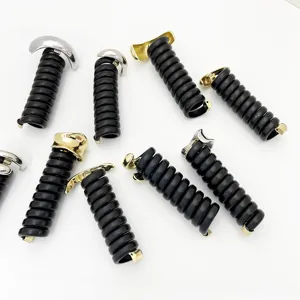 Detail of black telephone wire hair rings with elegant gold and silver metal clips