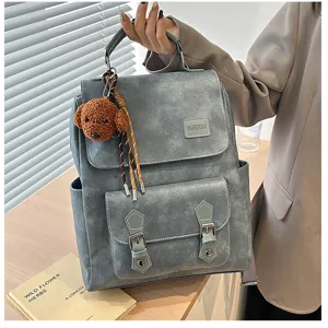 Zaino vintage in pelle PU blu-grigio con un simpatico ciondolo a cane e fibbie decorative