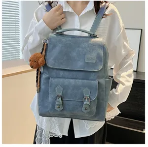 Zaino vintage in pelle PU blu per donna con fibbie doppie e un ciondolo a forma di cucciolo