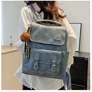 Vista posteriore di un grande zaino vintage in pelle PU blu da donna con orsetto