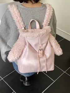 Linda mochila rosa con correas y adornos de orejas de conejo, ideal para estudiantes