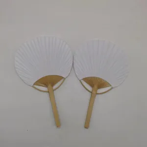 Detail view of two white round fans with bamboo handles, ideal for DIY crafts and painting.