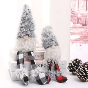 Detailed view of cute Christmas plush gnome dolls with long legs and grey fuzzy hats for holiday decor.