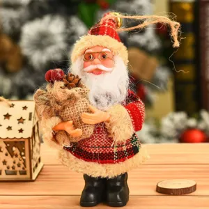 Standing Santa Claus doll ornament, festive fabric Christmas decoration for home display.