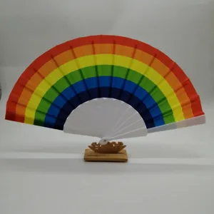 Detail view of the 23cm colorful rainbow folding fan with white plastic ribs and display stand.