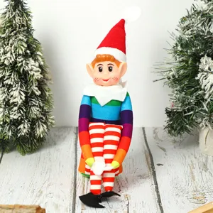 Detailed view of a colorful Christmas long-legged elf plush doll toy sitting on a rustic wooden table.