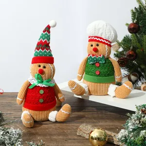Detailed view of handmade knitted gingerbread man plush dolls for Christmas decor.