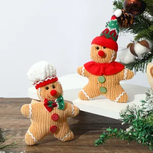 Close-up detail of plush gingerbread man Christmas ornaments with soft knitted texture