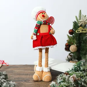 Close-up detail of a charming knitted gingerbread man plush doll for Christmas decor