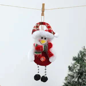 Detailed shot of cute plush snowman hanging ornament with plaid hat for Christmas tree decor.