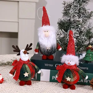 Detailed view of cute Christmas plush doll pendants, featuring festive red and green plaid designs.