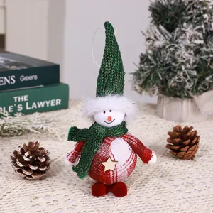 Christmas fabric snowman doll hanging ornament pendant for holiday tree decoration closeup.
