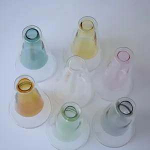 Close-up details of colorful double-layer glass vases showing transparent and vibrant hues.