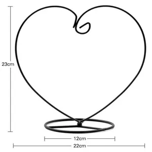 Black heart iron hanging display stand detail showing 23cm height and 12cm base dimensions.
