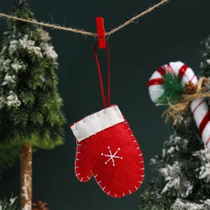 Christmas tree hanging decoration plush red mitten ornament with snowflake embroidery detail.
