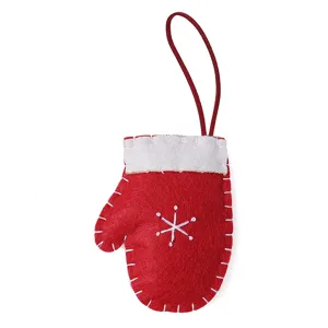 Red felt Christmas mitten ornament with white stitching and hanging loop for tree decor.