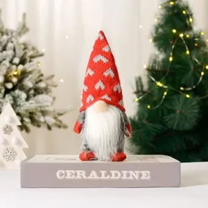 Detailed view of cute Christmas faceless gnome plush doll with red heart knit hat for holiday decor.