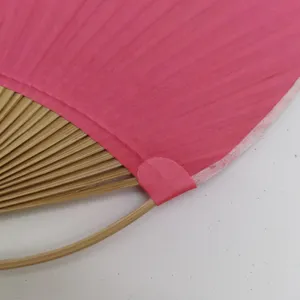 Handmade bamboo paper round fan, traditional pink handicraft fan main product view.