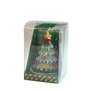 Christmas tree candle in clear gift box, festive holiday home decor and scented wax gift.
