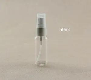 Close-up detail of 50ml clear plastic spray bottle with white mist sprayer and cap