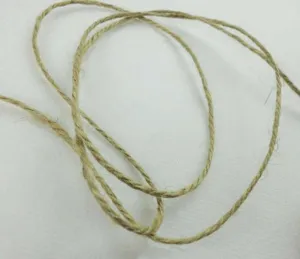 Natural jute twine detail shot, rustic brown hemp rope for DIY crafts and hanging vases.