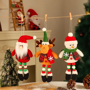 Close-up detail of cute Christmas plush hanging ornaments including Santa, reindeer and snowman.