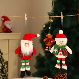 Christmas fabric hanging ornament detail, featuring cute plush snowman and Santa decor for tree.