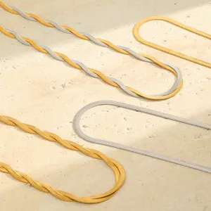 Detailed close-up showing 18K gold and silver plated woven herringbone blade chains.