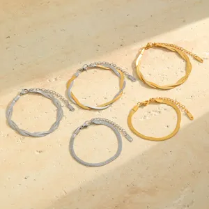 Detailed macro view of assorted stainless steel herringbone and snake chain bracelets