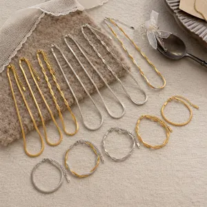 Detailed view of 18K gold plated and silver stainless steel blade and twisted chains