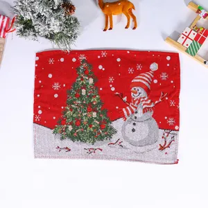 Christmas knitted placemat featuring festive snowman and tree pattern for holiday table decor.
