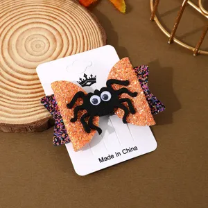 Halloween spider bow hair clip, cute glitter festive party costume hair styling accessory.