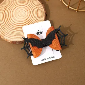 Halloween glitter bat bow hair clip detail shot, perfect spooky party hair accessories.