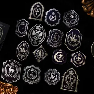 Set of vintage dark gothic heraldic crest stickers with silver emblems for journal decor