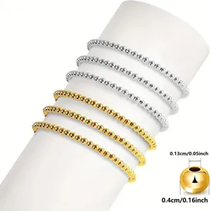 Vista detallada de cuentas espaciadoras de metal dorado y plateado de 4 mm para joyería