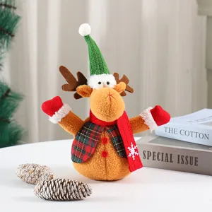 Christmas reindeer plush doll decoration with cute green knitted hat and festive red scarf.