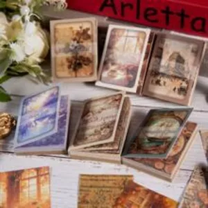 Detaillierte Ansicht von Vintage-Fensterszenen-Aufklebern für kreatives DIY-Scrapbooking.
