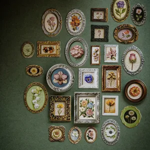 Assorted vintage 3D floral stickers in mini antique frames for scrapbooking journal decor.