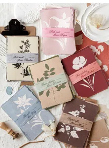 Detailed view of vintage floral silhouette decorative paper packs for scrapbooking