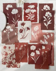 Close-up of assorted vintage floral silhouette decorative paper cards for scrapbooking