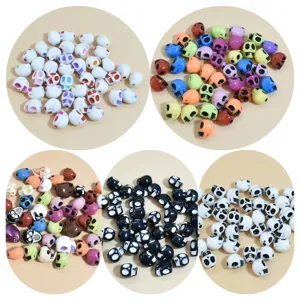 Detailed view of mixed colored 10-13mm acrylic skull beads for DIY craft projects