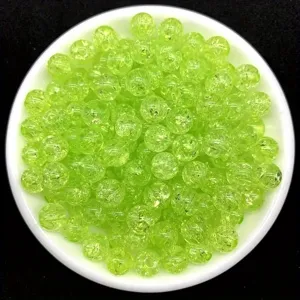 Macro view of unique ice crackle texture on 8mm lime green acrylic beads for DIY jewelry