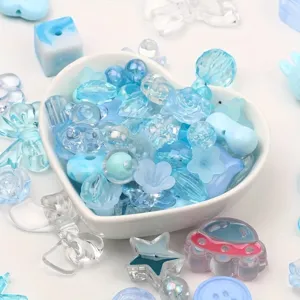 Detail shot of blue acrylic beads in various shapes and sizes for DIY jewelry making